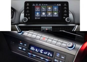 An image showing a button and touchscreen car infotainment display