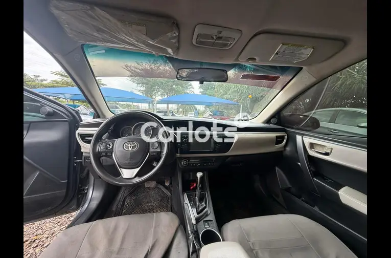 Nigerian Used 2014 TOYOTA COROLLA for sale in Abuja, FCT - photo 3 of 5