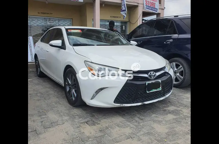 Registered 2015 Toyota Camry SE (white)