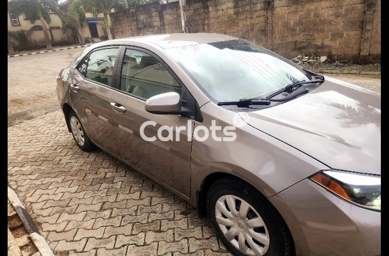 Clean Foreign-Used 2014 Toyota Corolla LE – Gold (Buy and Drive) for sale in Ikeja, Lagos