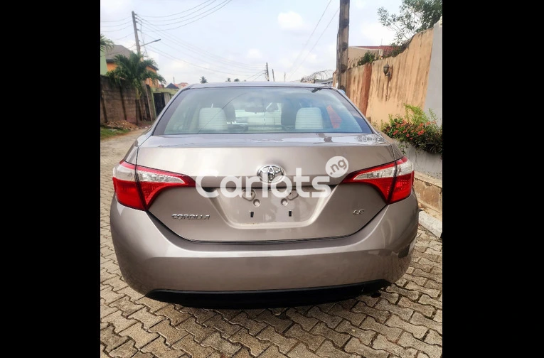 Clean Foreign-Used 2014 Toyota Corolla LE – Gold (Buy and Drive) for sale in Ikeja, Lagos