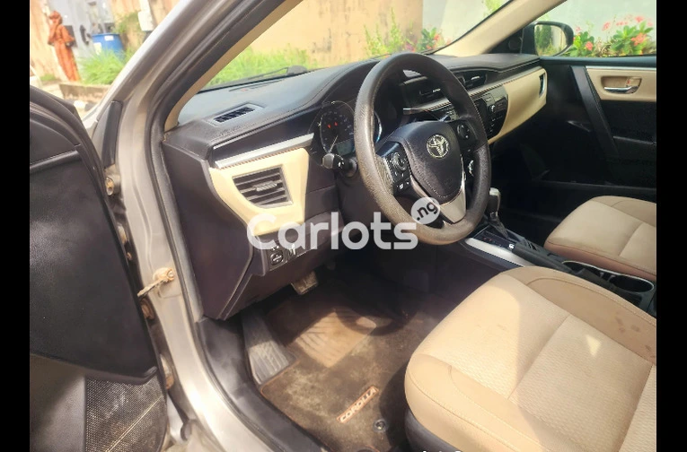Clean Foreign-Used 2014 Toyota Corolla LE – Gold (Buy and Drive) for sale in Ikeja, Lagos